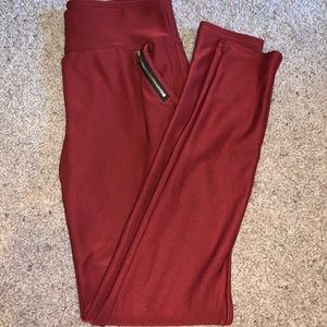 Rusty orange/red spandex pants with zipper pockets